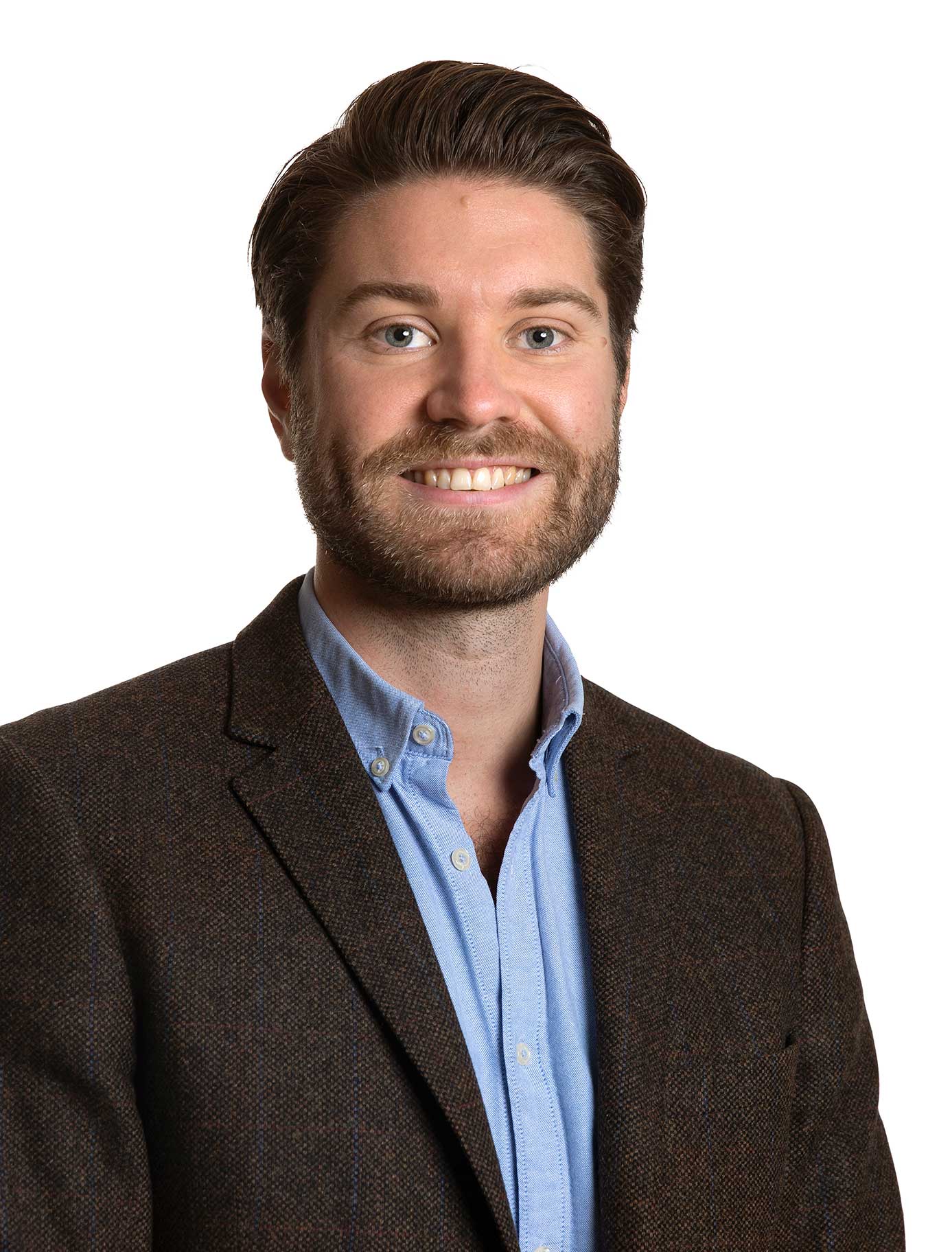 Personalporträtt med enhetlig stil, fotograferat för företagsprofil i Malmö.